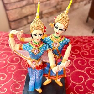 Colorful Traditional Figurines in Blue and Gold